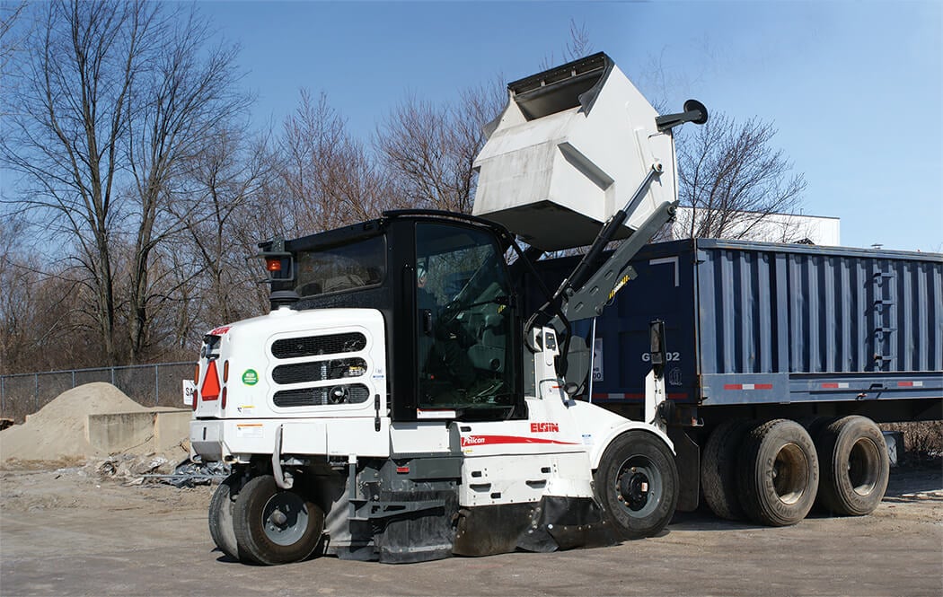 Dumping into Dump Truck